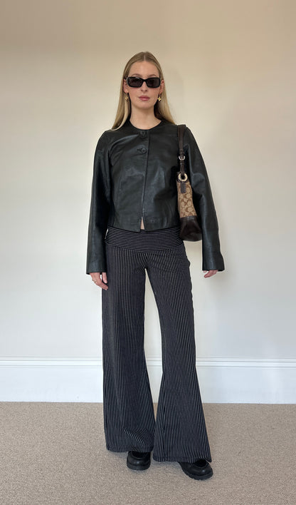 Vintage black collarless leather jacket