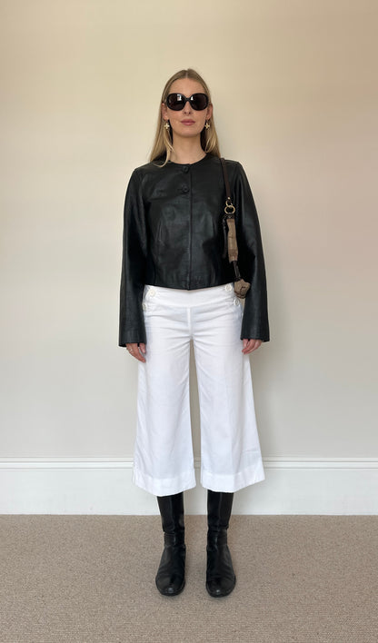 Vintage black collarless leather jacket