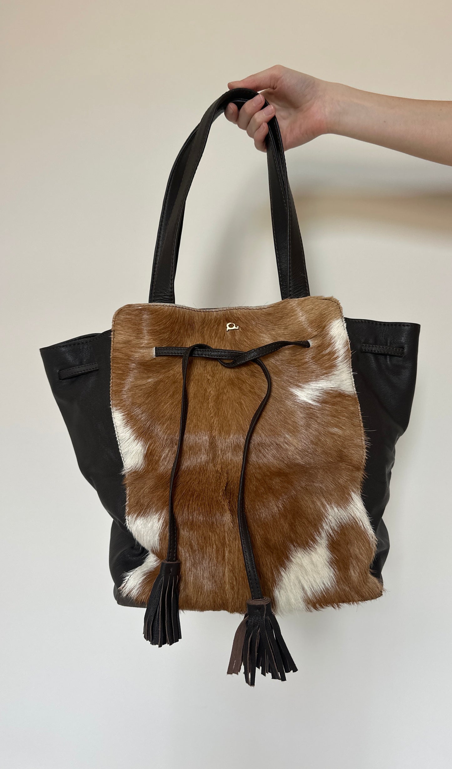 Cow hide tassle bag