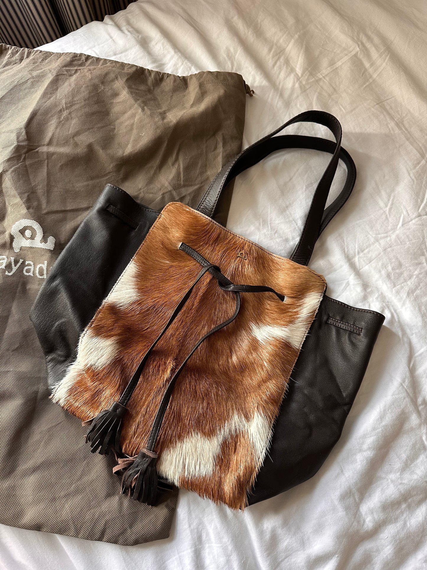 Cow hide tassle bag