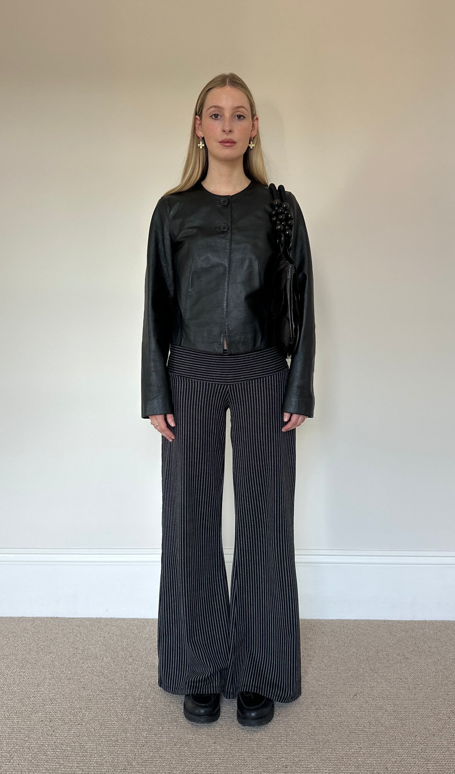 Vintage black collarless leather jacket