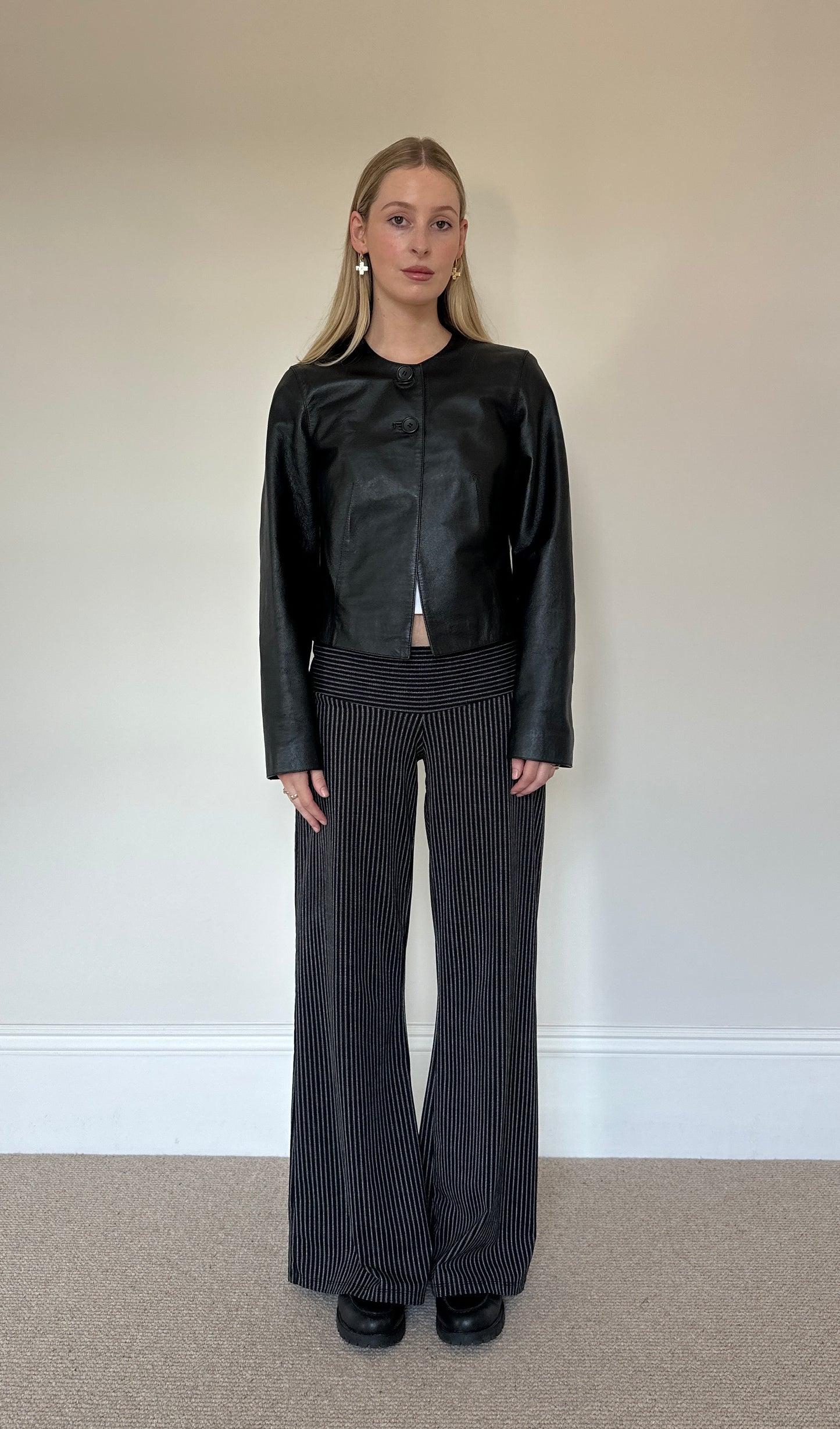 Vintage black collarless leather jacket