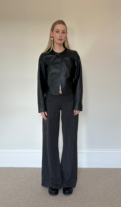 Vintage black collarless leather jacket