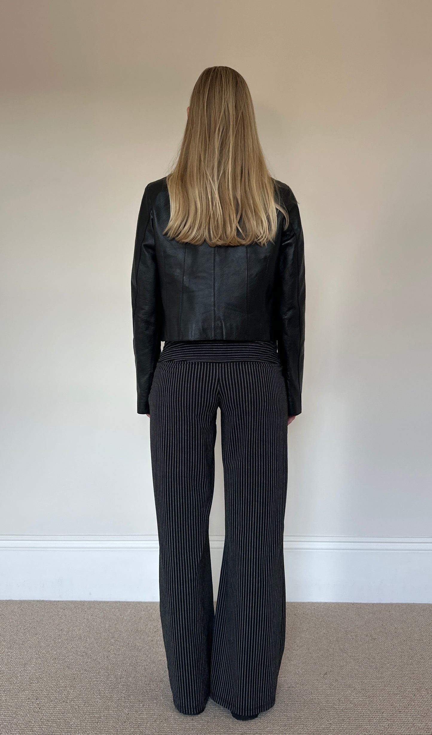 Vintage black collarless leather jacket