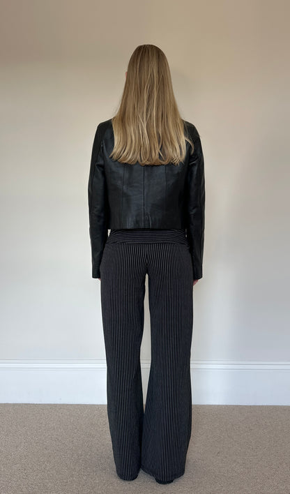 Vintage black collarless leather jacket